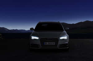 Sleek Audi A6 In Motion Wallpaper