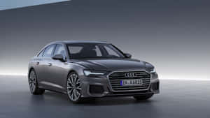 Sleek Audi A6 In Motion Wallpaper