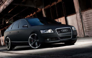 Sleek Audi A6 In Vibrant City Setting Wallpaper