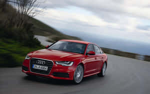 Sleek Audi A6 On The Open Road Wallpaper