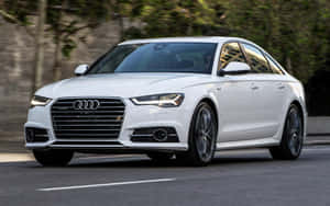 Sleek Audi A6 On The Road Wallpaper