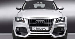 Sleek Audi Q5 In Urban Setting Wallpaper