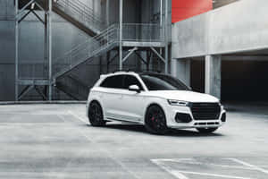 Sleek Audi Q5 On A Scenic Drive Wallpaper