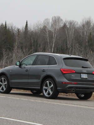 Sleek Audi Q5 On A Scenic Route Wallpaper