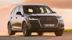 Sleek Audi Q7 In Urban Setting Wallpaper