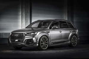 Sleek Audi Q7 On The Open Road Wallpaper