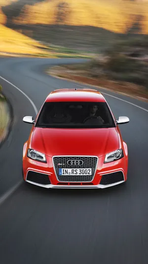 Sleek Audi Rs3 On A City Road Wallpaper