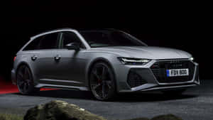 Sleek Audi Rs6 In Motion On An Open Road Wallpaper