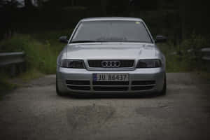 Sleek Audi S4 In Motion On A Highway Wallpaper