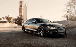 Sleek Audi S5 On A Scenic Backdrop Wallpaper