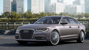 Sleek Audi S6 In Radiant Cityscape Wallpaper