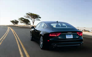 Sleek Audi S7 In Motion Wallpaper