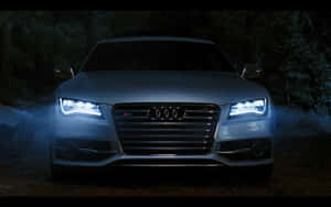 Sleek Audi S7 On The Open Road Wallpaper