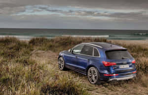 Sleek Audi Sq5 In Motion Wallpaper