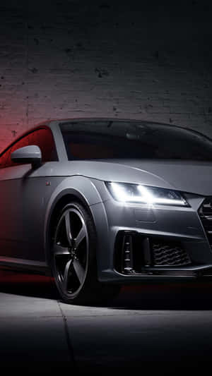 Sleek Audi Tt Rs Racing On The Road Wallpaper