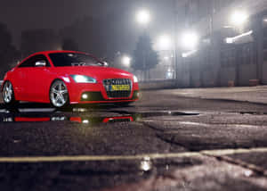 Sleek Audi Tt Sports Car In Urban Environment Wallpaper