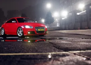 Sleek Audi Tt Sports Car In Urban Environment Wallpaper