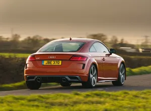 Sleek Audi Tt Sports Car On A Scenic Route Wallpaper