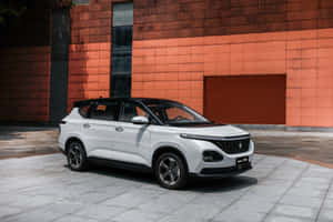 Sleek Baojun Vehicle Parked In The City Wallpaper