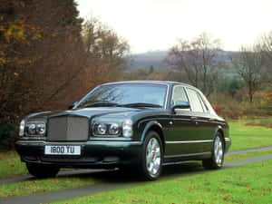 Sleek Bentley Arnage On A Scenic Road Wallpaper