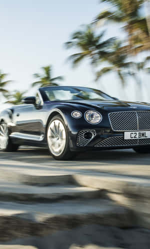 Sleek Bentley Continental Gt Taking The Road By Storm Wallpaper