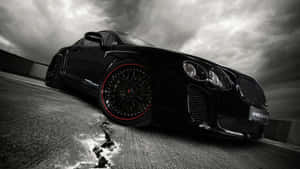 Sleek Black And White Car Against A Monochrome Backdrop Wallpaper