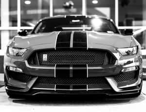 Sleek Black And White Car In Urban Setting Wallpaper