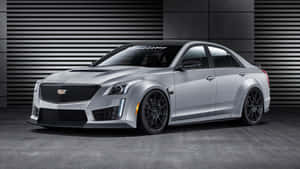 Sleek Black Cadillac Cts On Highway Wallpaper