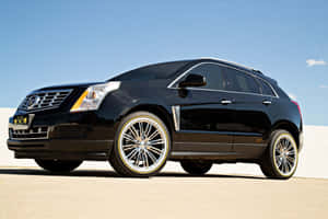 Sleek Black Cadillac Srx Crossover Suv Wallpaper