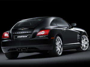 Sleek Black Chrysler Crossfire On The Road Wallpaper