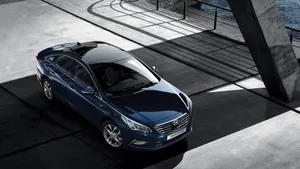 Sleek Black Hyundai Sonata In Nature Wallpaper