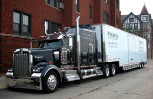 Sleek Black Kenworth W900 Transportation Truck In High Resolution Wallpaper