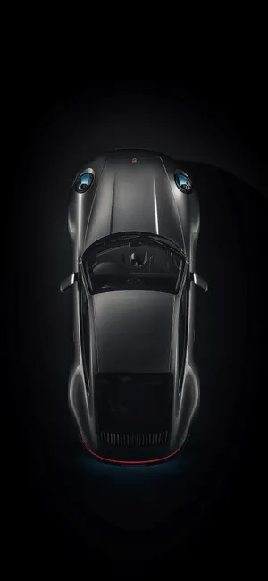 Sleek Black Porsche On The Go Wallpaper
