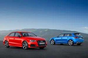 Sleek Black Sedan On City Street Wallpaper