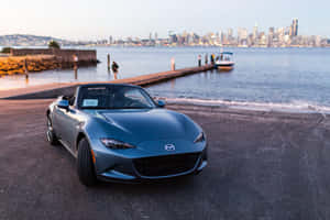 Sleek Blue Miata Sports Car Wallpaper