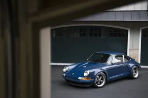 Sleek Blue Singer Porsche Wallpaper