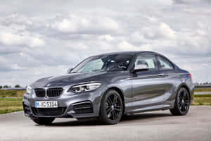 Sleek Bmw 2 Series In Urban Setting Wallpaper