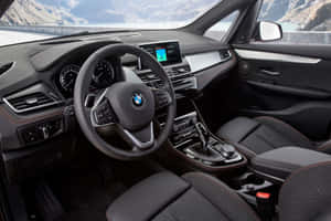 Sleek Bmw 2 Series In Vibrant Setting Wallpaper