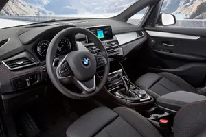 Sleek Bmw 2 Series In Vibrant Setting Wallpaper