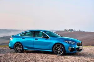 Sleek Bmw 2 Series On The Open Road Wallpaper