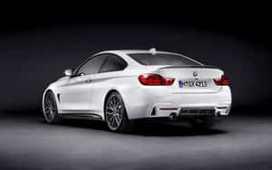 Sleek Bmw 4 Series Coupe In Action Wallpaper