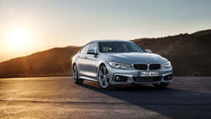 Sleek Bmw 4 Series Sports Coupe In Action Wallpaper