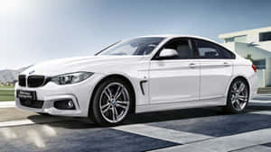 Sleek Bmw 4 Series Sports Coupe In Action Wallpaper