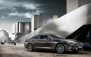 Sleek Bmw 6 Series In Vibrant City Setting Wallpaper