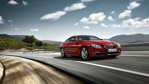 Sleek Bmw 6 Series Sports Coupe In Action Wallpaper