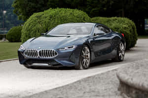 Sleek Bmw 8 Series Coupe On The Road Wallpaper