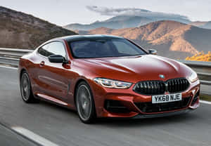 Sleek Bmw 8 Series In Motion On The Road Wallpaper