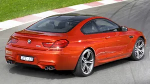 Sleek Bmw M6 Cruising The Streets Wallpaper