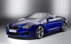 Sleek Bmw M6 In Dynamic Motion Wallpaper
