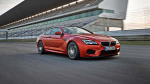 Sleek Bmw M6 In Motion Wallpaper